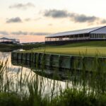 Scenic view of the Kiawah Island golf course with pavilions at sunrise.